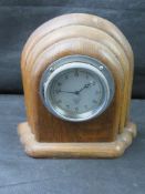 A Smiths mantle clock in Art Deco style oak case.