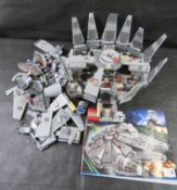 A part built Star Wars Lego Millenium Falcon including 11 minifigures.