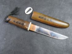 A WWII style Japanese tanto dagger having leather covered handle and sheath with horn mounts (one