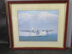 A set of three nautical prints in matching frames.