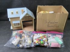 Sylvanian Families house with box of accessories, various parts and characters.