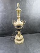 A large and impressive Neoclassical style urn lamp with ornate handles and a decorated pedestal