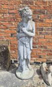 A concrete garden female statue draped classical design with a heavily weathered finish