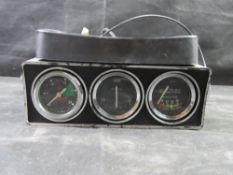 A 1970s accessory gauge set by Smiths, designed for classic British cars like the Mini 1275 GT, Imp,