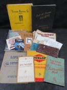 A collection of vintage automotive literature including a Dunlop Rubber Co. Ltd.