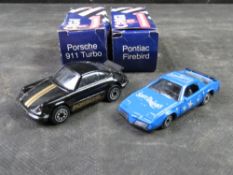 Two Corgi Juniors diecast models being Porsche 911 Turbo and a Pontiac Firebird in original boxes.