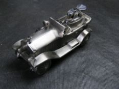 A c1960-70s table lighter shaped like a classic automobile,