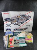 A collection of vintage automotive literature including Rothmans Porsche 956 cutaway poster,