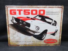 A contemporary vintage-style metal wall sign features a distressed finish and depicting a 1967