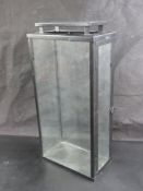 A contemporary glazed black metal lantern standing 50cm high