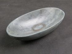 A carved hardstone bowl, native Canadian style, 27cm wide.