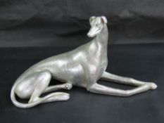 A contemporary chrome resin figure of a greyhound 34cm in length