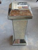 A contemporary mirrored glass pedestal, slight a/f,