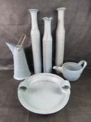 A set of blue glazed pottery vases, bowl, and jugs.