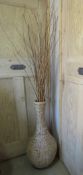 A large seagrass type floorstanding vase.