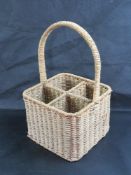 A four bottle seagrass wine basket