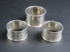 Three hallmarked silver napkin rings.