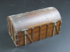 A wooden casket type trinket box having metal fittings and domed lid, 20cm wide.