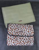 Two jewellery storage rolls.
