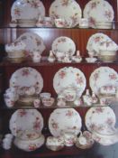 A Crown Derby dinner and tea service in Derby Posies pattern, 12 place settings.