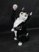 A Just Cats & Co tuxedo cat.