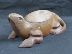 A carved African hardwood, lidded pot in the form of a lizard, approx 32cm in length.