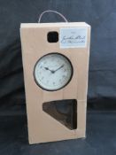 A garden clock and thermometer, as new in box.