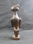 An African hardwood carved wooden figure of a bird,