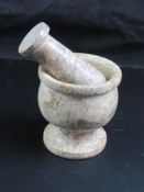 A small marble mortar and pestle