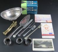 A pair of hallmarked silver napkin rings (slightly a/f) together with a silver plated bon bon dish,