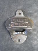 A contemporary cast iron bottle opener 'Drink Peroni'.