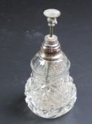 A cut glass and sterling silver atomiser perfume bottle.