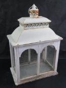 A contemporary glazed wooden lantern standing 48 cm high