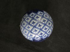 A contemporary Chinese blue and white ceramic ball.
