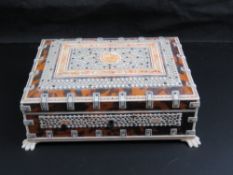 A faux tortoiseshell and bone jewellery casket, approx 21cm wide,