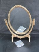 A free standing dressing table mirror having gilded plaster decoration upon, slightly a/f,
