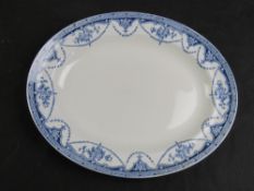 A blue and white meat serving dish 36cm wide.
