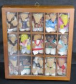 A collection of McDonalds Wombles in display case.