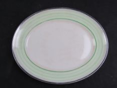 An Art Deco green and white meat serving platter, 36cm wide.