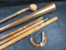A quantity of walking sticks including a/f dogs head handle, also a copper coaching horn.