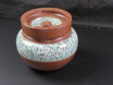 An early 20th century tobacco jar with lid.