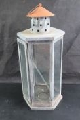 A contemporary glazed metal industrial style lantern standing 52 cm high,
