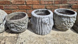 Three concrete planters.