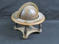 A contemporary desktop globe approx 24cm wide.