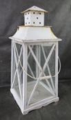 An oversized floor standing glazed lantern, 78cm high.