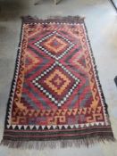 A woven rug in geometric pattern, a/f.
