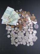 A quantity of assorted vintage world coinage including 463.5g of half silver British coinage.