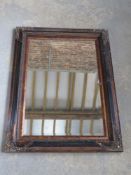 A contemporary bevel edged mirror in painted recessed frame,