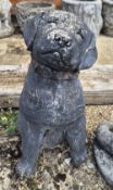 Concrete garden figurine of a Labrador puppy