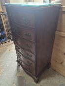 A circa 1980's reproduction serpentine front tallboy having 6 drawers each with twin drop handles